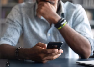 Man on phone USSD charges